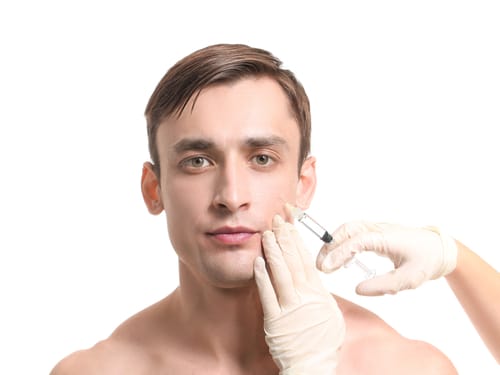 Handsome,Man,Receiving,Filler,Injection,On,White,Background