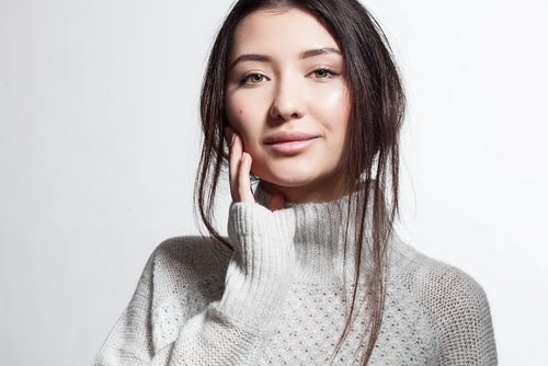 Pretty,Smiling,Woman,With,Clean,Skin,In,White,Fluffy,Sweater